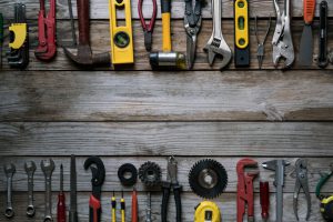 Old tools on wood table background